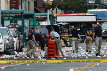 US police investigate the scene for more bombs