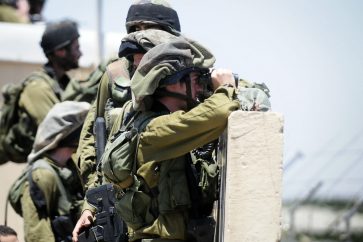 Israeli forces monitoring the Syrian border