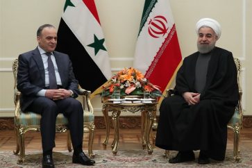 Syrian Prime Minister Imad Khamis (L), Iranian President Sheikh Hassan Rouhani (R) in Tehran