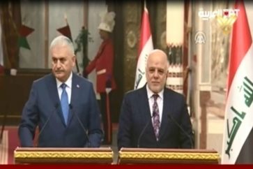 Iraqi Prime Minister Haidar Abadi and his Turkish counterpart Binali Yildirim dudring their jont press conference in Baghdad on January 7