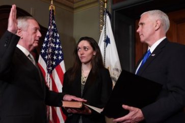 US Vice President Mike Pence, right, swears in James Mattis (L) as US Secretary of Defense in the Vice President's Ceremonial Office in the Old Executive Office Building in Washington, DC, January 20, 2017