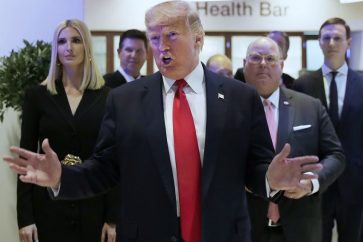 U.S. President Donald Trump reacts after addressing the World Economic Forum in Davos, Switzerland, Tuesday, Jan. 21, 2020. The 50th annual meeting of the forum will take place in Davos from Jan. 21 until Jan. 24, 2020. Left is Ivanka Trump. (AP Photo/Markus Schreiber)