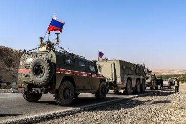 Russian military police as they enter the base at the Tishrin Dam on the Euphrates, 90 kilometers (56 miles) east of Aleppo, Nov. 18, 2019.
