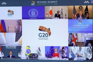 Japanese Prime Minister Yoshihide Suga (top L), US President Donald Trump (top R), South Korean President Moon Jae-in (down L), and European Commission President Ursula von der Leyen (down C) are seen on a screen before the start of a virtual G20 summit hosted by Saudi Arabia and held over video conference amid the Covid-19 (novel coronavirus) pandemic, in Brussels, on November 21, 2020. - Saudi Arabia hosts a G20 summit on November 21 and 22, in a first for an Arab nation, with the virtual forum dominated by efforts to tackle the coronavirus pandemic and the worst global recession in decades. (Photo by YVES HERMAN / POOL / AFP) (Photo by YVES HERMAN/POOL/AFP via Getty Images)