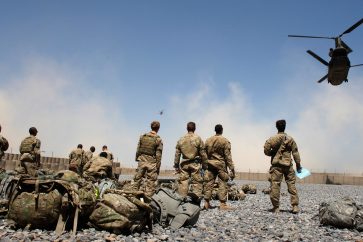 Helicopters carrying U.S. Army soldiers from the 1-320 Field Artillery Regiment, 101st Airborne Division, take off from Combat Outpost Terra Nova as the soldiers head home following a 10-month deployment in the Arghandab Valley north of Kandahar April 23, 2011.  REUTERS/Bob Strong  (AFGHANISTAN - Tags: MILITARY POLITICS IMAGES OF THE DAY)
