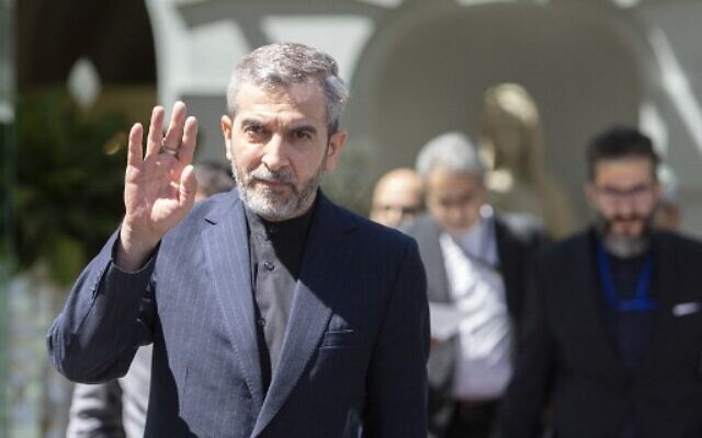 Iran's chief nuclear negotiator Ali Bagheri Kani waves as he leaves after talks at the Coburg Palais, the venue of the Joint Comprehensive Plan of Action (JCPOA) in Vienna on August 4, 2022. - The United States and the European Union's Iran nuclear envoys on August 3, 2022 said they were travelling to Vienna for talks with Tehran's delegation as they seek to salvage the agreement on its atomic ambitions. (Photo by Alex HALADA / AFP)