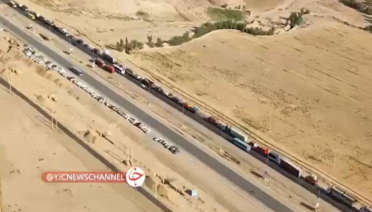 A long queue of Iranian trucks carrying foodstuffs to Holy Karbala City