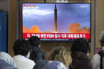 A TV screen shows a file image of North Korea's missile launch during a news program at the Seoul Railway Station in Seoul, South Korea, Friday, Nov. 4, 2022. South Korea scrambled dozens of military aircraft, including advanced F35 fighter jets, after spotting North Korean warplanes Friday, flying in North Korean territory in what appeared to be a defiant show of strength. (AP Photo/Ahn Young-joon)