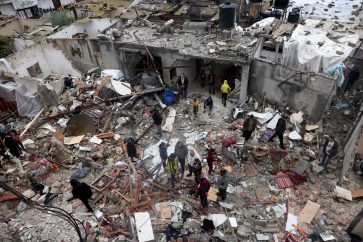 Palestinians inspect the destruction following the Israeli bombardment of the Rafah refugee camp in the southern Gaza Strip on November 15, 2023, amid the ongoing battles between Israel and the Palestinian group Hamas. More than 10,000 people have been killed in relentless Israeli bombardment of the Gaza Strip, according to the Hamas-run health ministry, since the war erupted after Palestinian militants raided southern Israel on October 7 killing at least 1200 people, according to official Israeli figures. (Photo by Mohammed ABED / AFP)