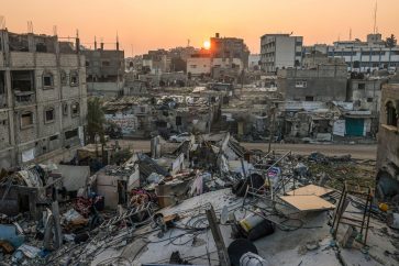 TOPSHOT - The sun rises above the Rafah refugee camp in the southern Gaza Strip on January 1, 2024, amid the ongoing conflict between Israel and the Palestinian militant group Hamas. (Photo by AFP)