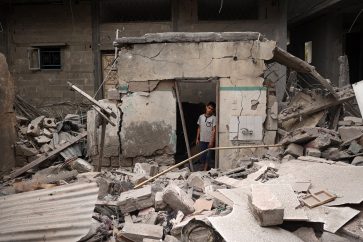 A Palestinian child stands amid the debris of a house destroyed by overnight Israeli bombardment in Rafah in the southern Gaza Strip on April 27, 2024, as the conflict between Israel and the militant group Hamas continues. (Photo by AFP)